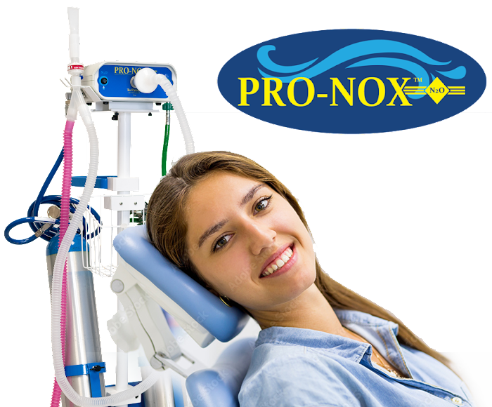 Cosmetic surgery patient smiling next to Pro-Nox System