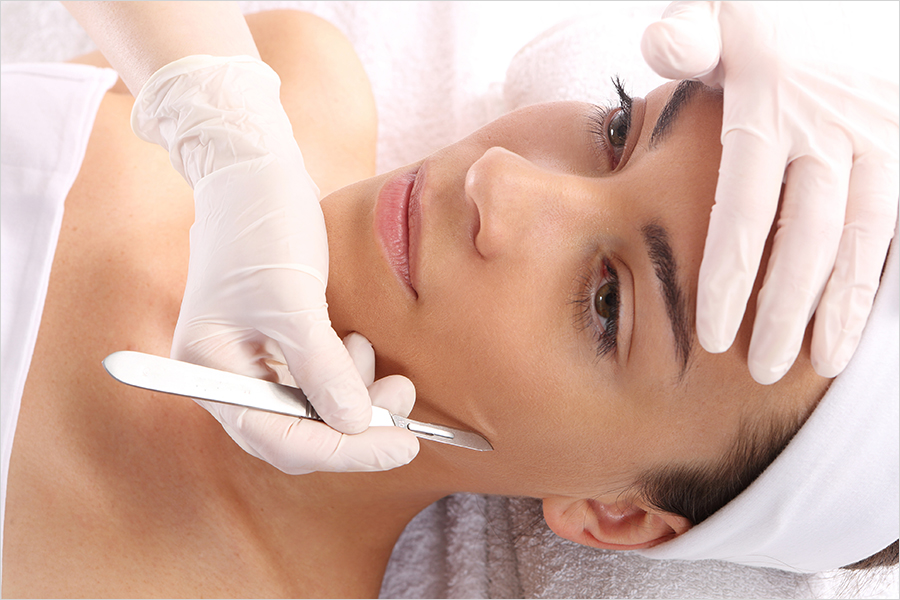 Caucasian woman during surgery using a scalpel